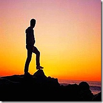 Man-on-cliff-and-sunset-2.jpg